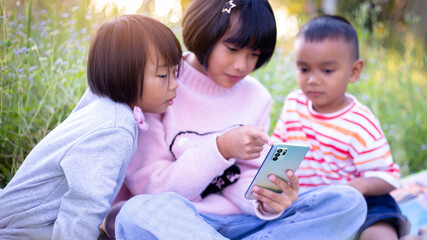 Kids exploring in forest with a magnifying glass