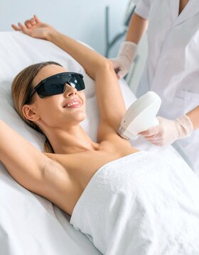 Woman getting laser hair removal on her underarm