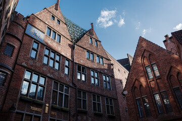 Fototapeta premium A low-angle view of the historic Glockenspiel House (Haus des Glockenspiels) on Böttcherstraße in Bremen, Germany. 
