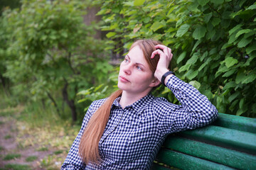 Young pretty girl on the bench