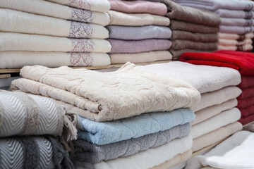 Colorful stacks of folded Turkish towels on display at textile market in Bursa, Turkey