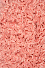 A close-up of raw ground pork and beef, with visible texture and a pale pink colo