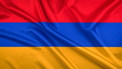 Naklejka premium Armenian flag with horizontal red, blue, and orange stripes, displayed on a textured, gently waving fabric.