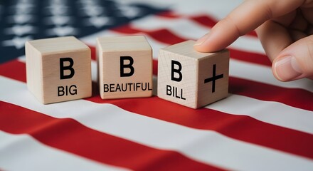Finger points to wooden blocks spelling bbb on american flag