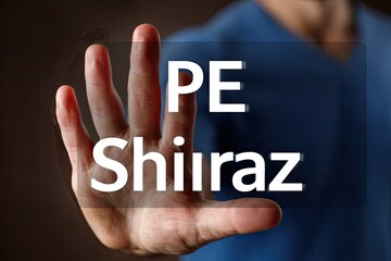Hand hovering over a translucent interface displaying "PE Shiraz
