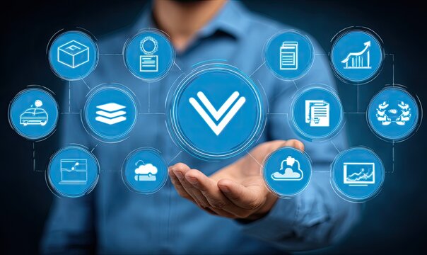 A hand holds a digital interface displaying various interconnected business icons, centered on a downward-pointing arrow - Powered by Adobe