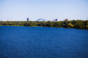 city nature waterfront district river panorama outskirts landscape with park and buildings...