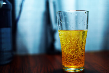 glass of vitamin C on wood table background