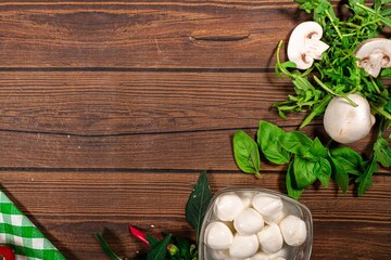 Background for Pizza with tomatoes, mozzarella cheese, black olives and basil. Mock up for...