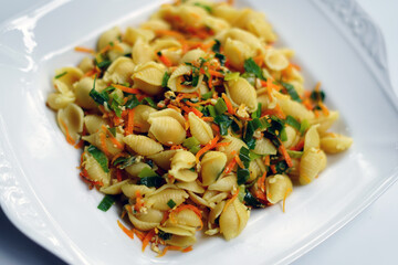 Close-Up of Vegetarian Pasta Meal in White Bowl on White Surface