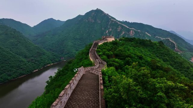 Aerial view ascending in front of the Great Wall of China, summer day in Beijing