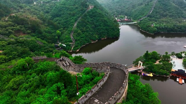 Aerial view tilting over the Huanghuacheng Lakeside Great Wall section, in China