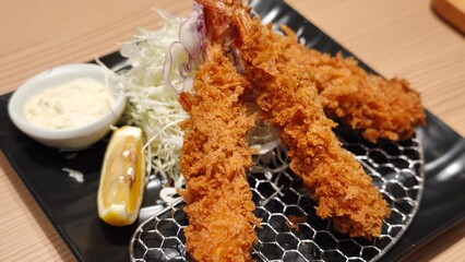 Japanese fried tempura shrimp with salad cream.