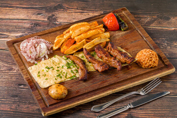 Grilled lamb fillet or Lamb Kusleme served with fries, lavash bread and bulgur pilaf