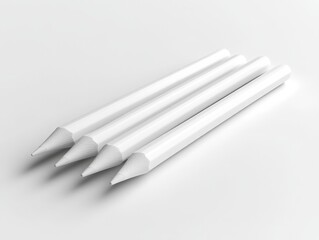 Four Minimalist White Pencils Arranged Diagonally on a Clean White Surface, Emphasizing Simplicity and Precision in Art Supplies.
