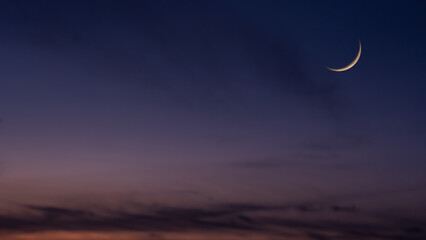Dusk sky Crescent moon on twilight after sundown, religion of Islamic well editing text Ramadan Kareem, Eid al Fitr, Eid Mubarak, Eid Al Adha, Muharram on free space backgrounds