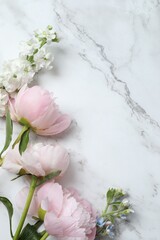 Vertical photo with pink peonies, top view, space for text