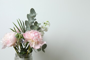 Bouquet of flowers and peonies in a vase