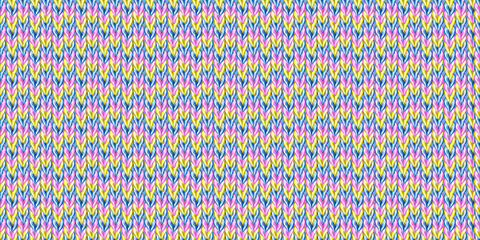 Seamless knitted pattern with rainbow multicolored yarn texture. Handmade, knitted and crocheted.