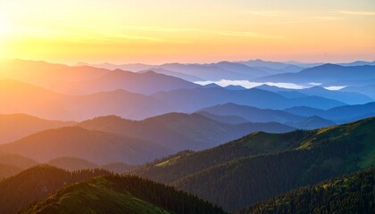 A panoramic view of a mountain range at sunrise, where golden light grazes the top ridges while the lower valleys are still covered in dense morning fog. 