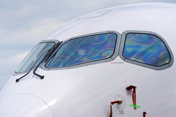 Close-up of cockpit of passenger airplane parked at Swiss Airport Zürich Kloten on a sunny day....