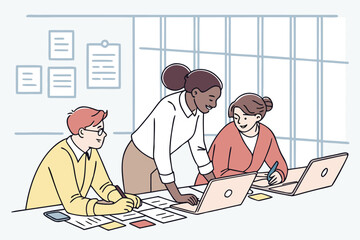 Team collaboration at a modern workspace with laptops and notes, showcasing creativity and problem-solving among colleagues during a brainstorming session