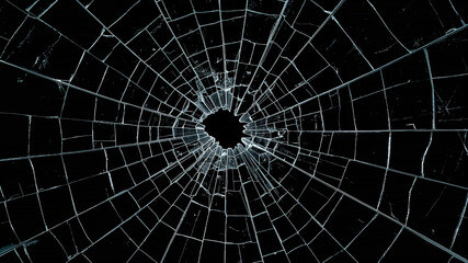 Obraz premium Broken glass showing cracks expanding on black background