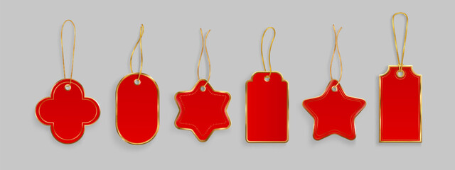 Red gift tags with gold string hanging loops - festive shapes of star and cross, oval and rectangle designs. Blank price labels for Christmas presents, retail merchandise or holiday decorations.