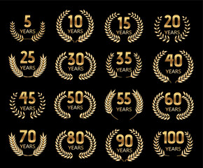 Elegant set of golden laurel wreath anniversary emblems with year numbers on black background. Ideal for award certificates, celebration invitations, jubilee promotions, and commemorative designs