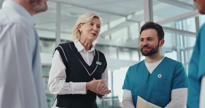 Woman, doctors and shaking hands with team at hospital with welcome, onboarding or happy in corridor. People, medical director and handshake with smile, recruitment and hiring with group at clinic