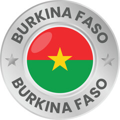 Burkina Faso flag in silver colored medal. National flag in metal circle emblem.