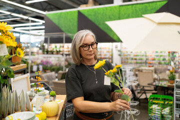 Middle-aged woman engages in shopping at a home improvement store in various departments for lifestyle and household items
