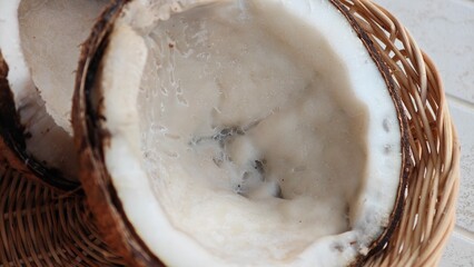 Rotten coconut fruit with brown shell.