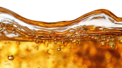 Sparkling amber liquid with bubbles against a black background