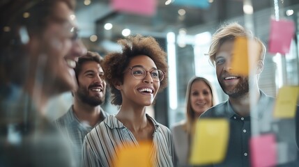 A dynamic team of diverse young professionals engaged in an open, collaborative meeting inside a bright modern office. Startup culture, workplace diversity, and modern corporate branding