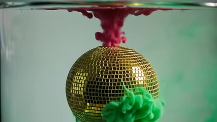 Colorful ink swirling around a reflective disco ball submerged in water, creating vibrant patterns - Powered by Adobe