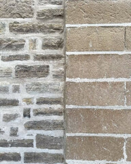 Two types of bricks meet at edge.