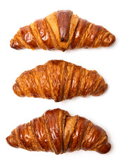 Three freshly baked classic delicious fresh organic croissants isolated on white background