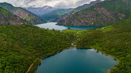 aerial view of sary chelek lake in Kyrgyzstan drone fly above scenic landscape with mountains in natural reserve