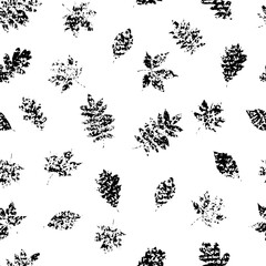 Fototapeta premium Seamless vector black and white grunge pattern with leaf imprints. Perfect for fabric, backgrounds, wrapping paper