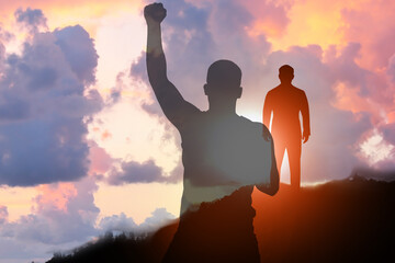 Hope. Silhouettes of man and winner on top of mountain at sunrise, double exposure