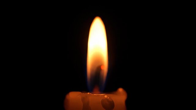 A Single Candle Flame Flickering Gently in the Darkness, Creating a Serene and Contemplative Mood, Ideal for Memorials, Prayer, or Meditation