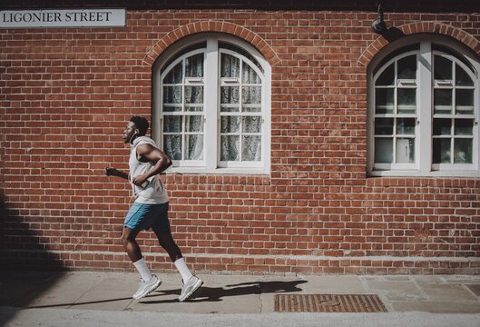 Man jogging in the city - Powered by Adobe