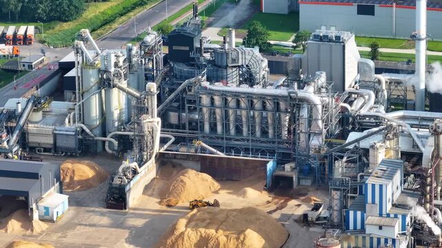 Innovative wood processing plant showcased in aerial view with bustling activity