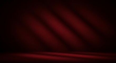 Dark red studio backdrop with diagonal light beams and soft shadows.