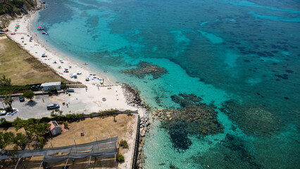 Beach Scene with Turquoise Waters and Recreation – Aerial View of Coastal Area in Calabria, Italy