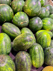 Ripe and sweet long watermelon under the supermarket light