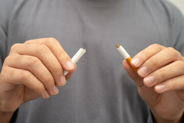 Quit smoking, Man breaking destroy cigarette.