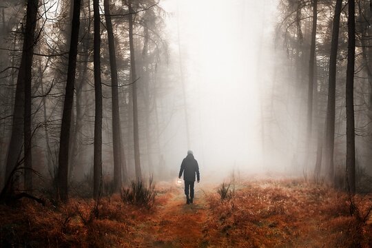 Man walking in mist background design