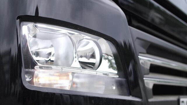 Truck headlights turning on and off, testing different light modes.